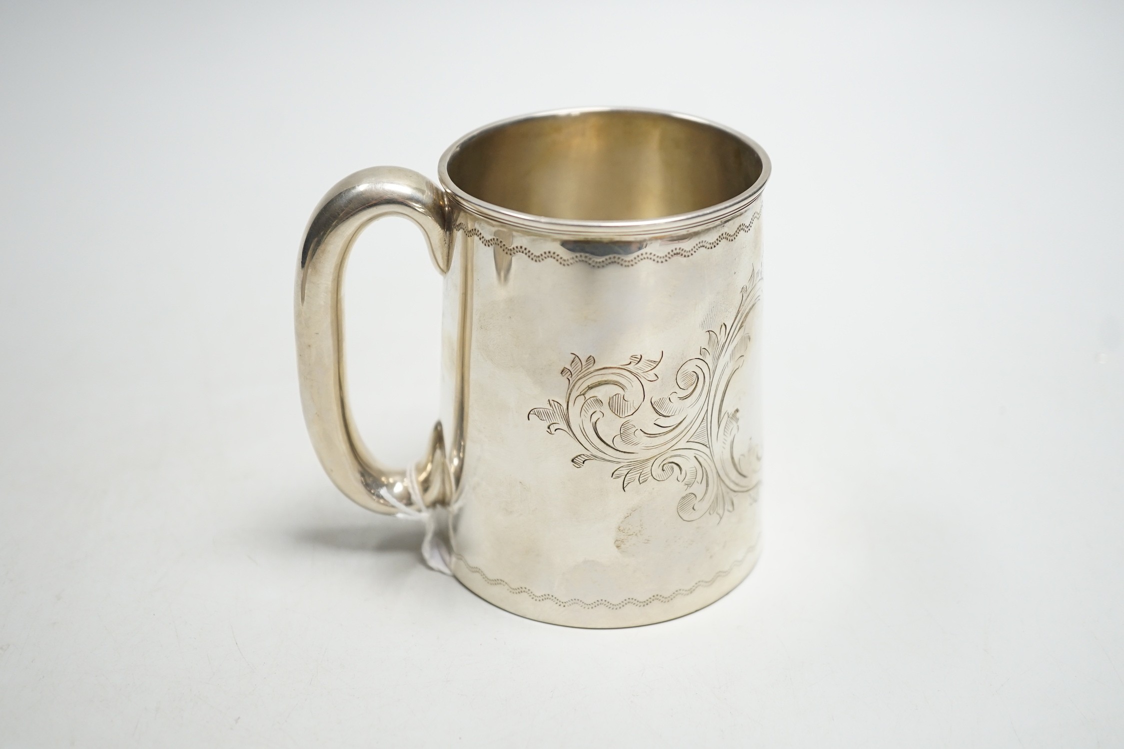 A Victorian engraved silver christening mug, Thomas White, Birmingham, 1872, 87mm.